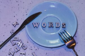Artistic display of letters spelling 'WORDS' on a plate with creative layout, perfect for typography enthusiasts.